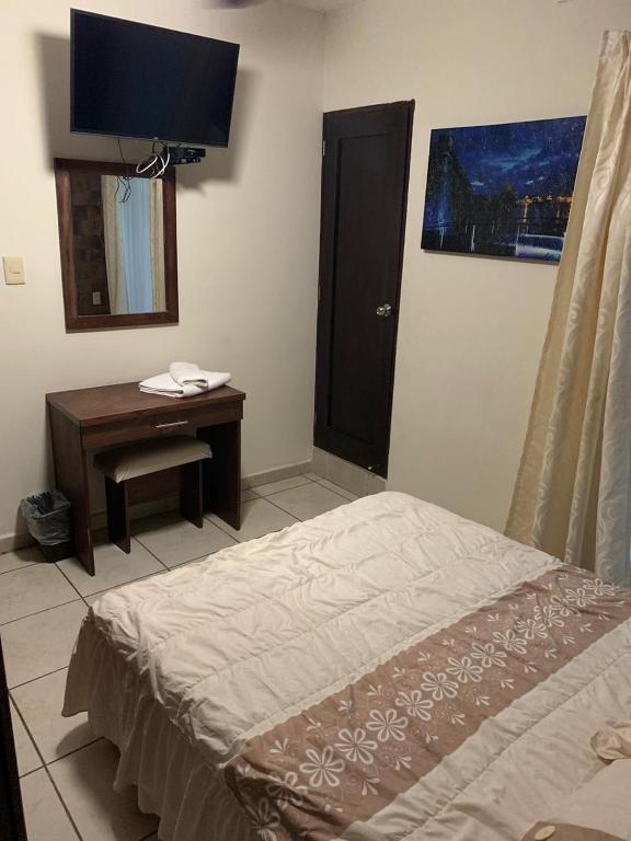 Postel nebo postele na pokoji v ubytování Hotel Posada San Juan