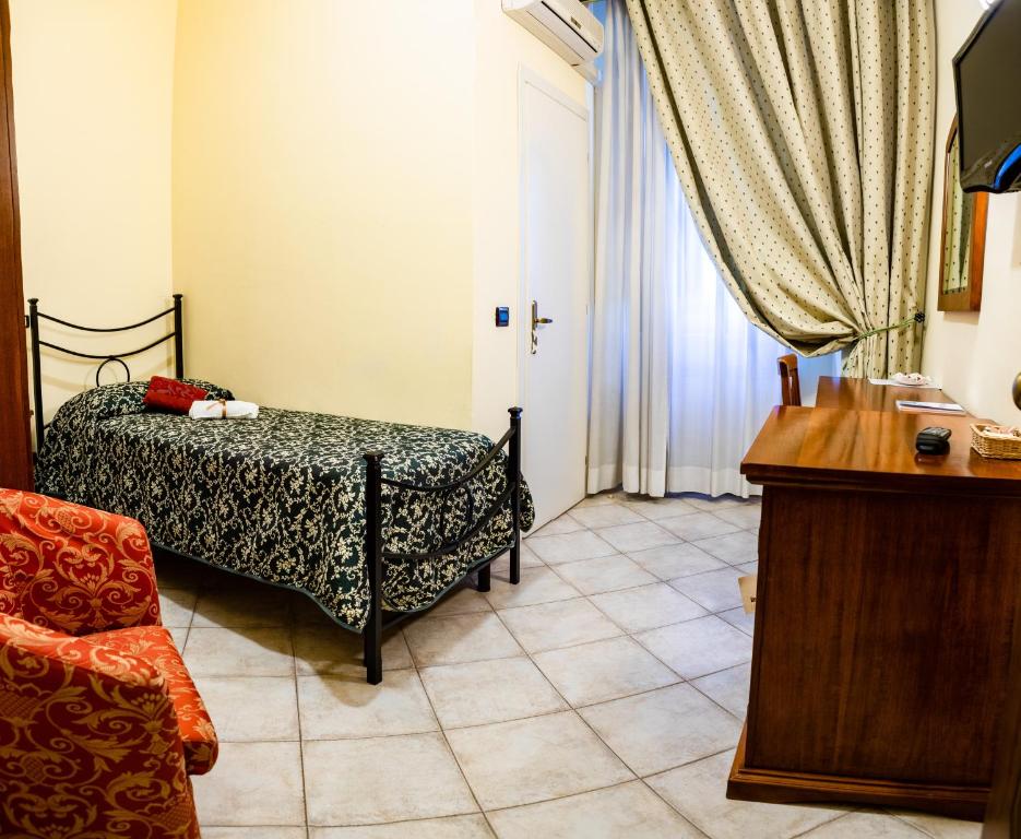 Postel nebo postele na pokoji v ubytování Hotel Il Cavalier D'Arpino
