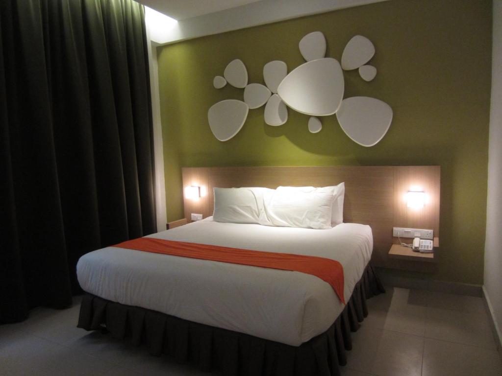 Postel nebo postele na pokoji v ubytování D Hotel