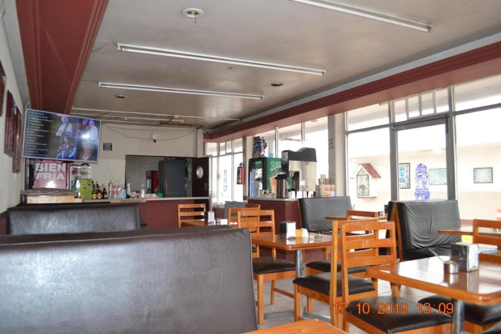 TV a/nebo společenská místnost v ubytování Hotel Pachuca Inn