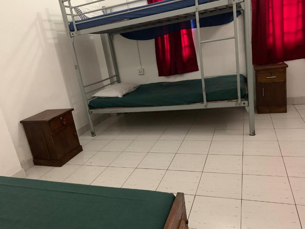 Postel nebo postele na pokoji v ubytování Sea Sands Beach Hostel
