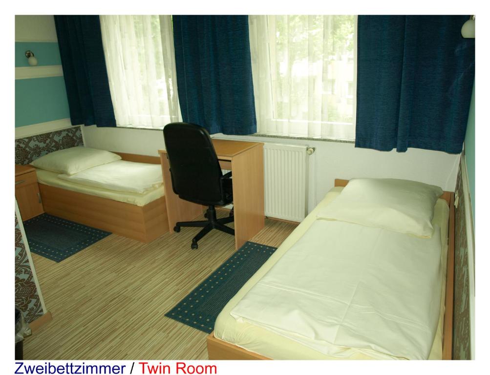 Postel nebo postele na pokoji v ubytování Pension Central Nuernberg-Fuerth