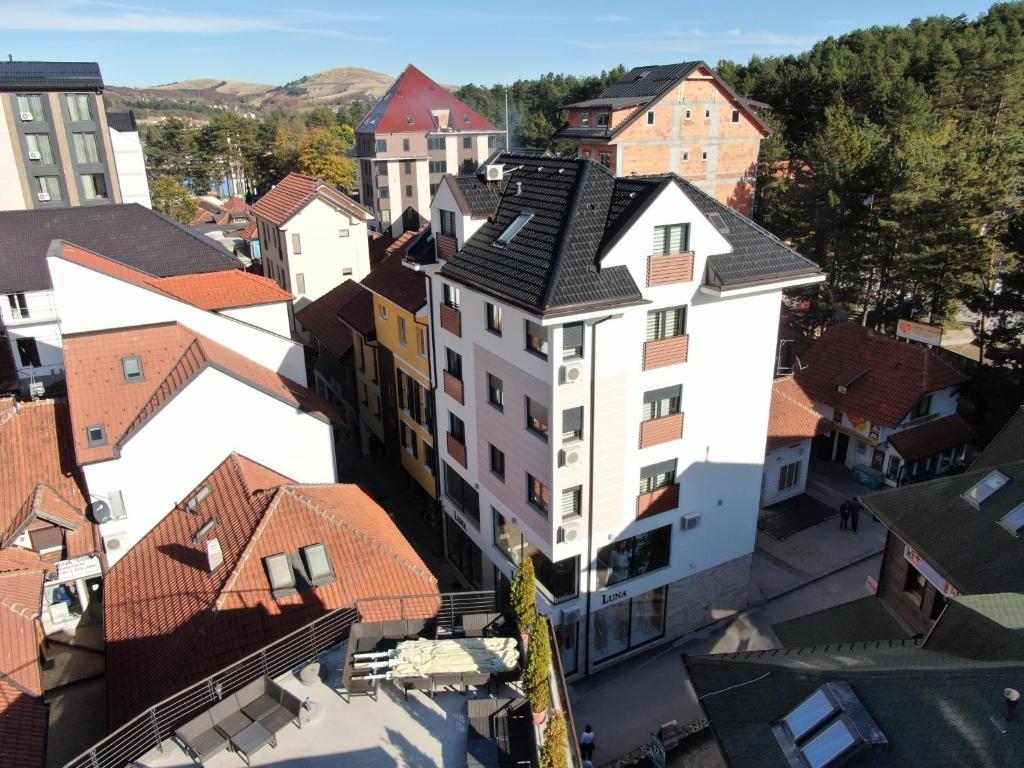 an overhead view of a city with buildings at Egoiste Guesthouse Zlatibor Center in Zlatibor