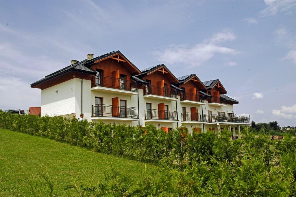 a large building on top of a hill at Szeptucha in Polańczyk