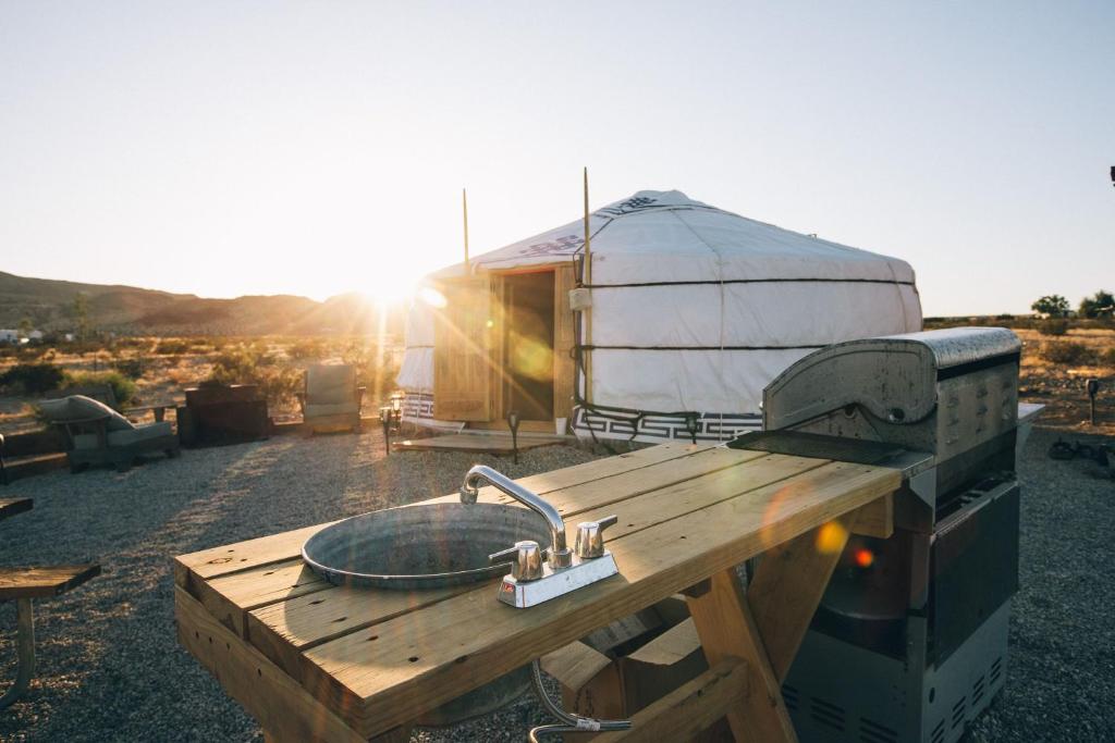 a wooden table with a sink and a yurt at 28 Palms Ranch in Twentynine Palms