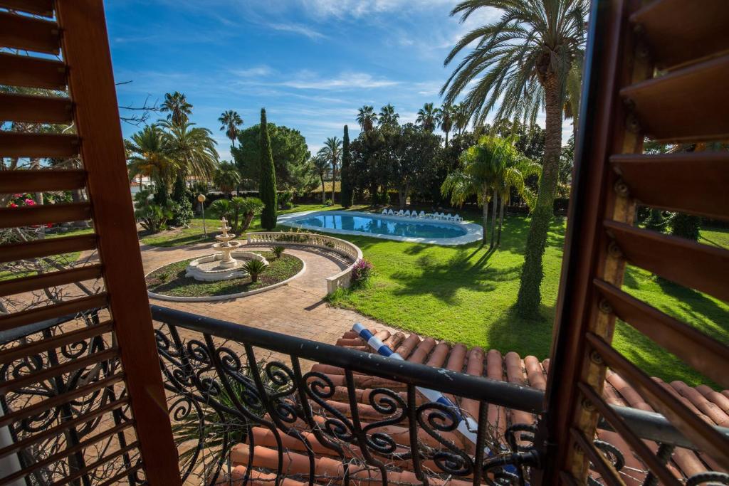 a view from the balcony of a resort with a swimming pool at Finca Casa Imas in Alicante