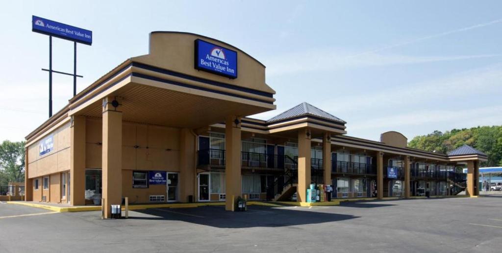 a large building with a sign on top of it at Americas Best Value Inn Alachua in Alachua