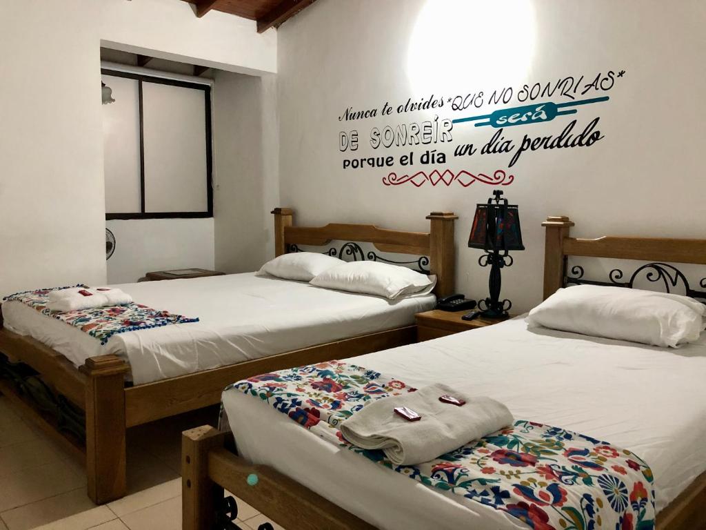 Postel nebo postele na pokoji v ubytování Hotel Casa Malibú