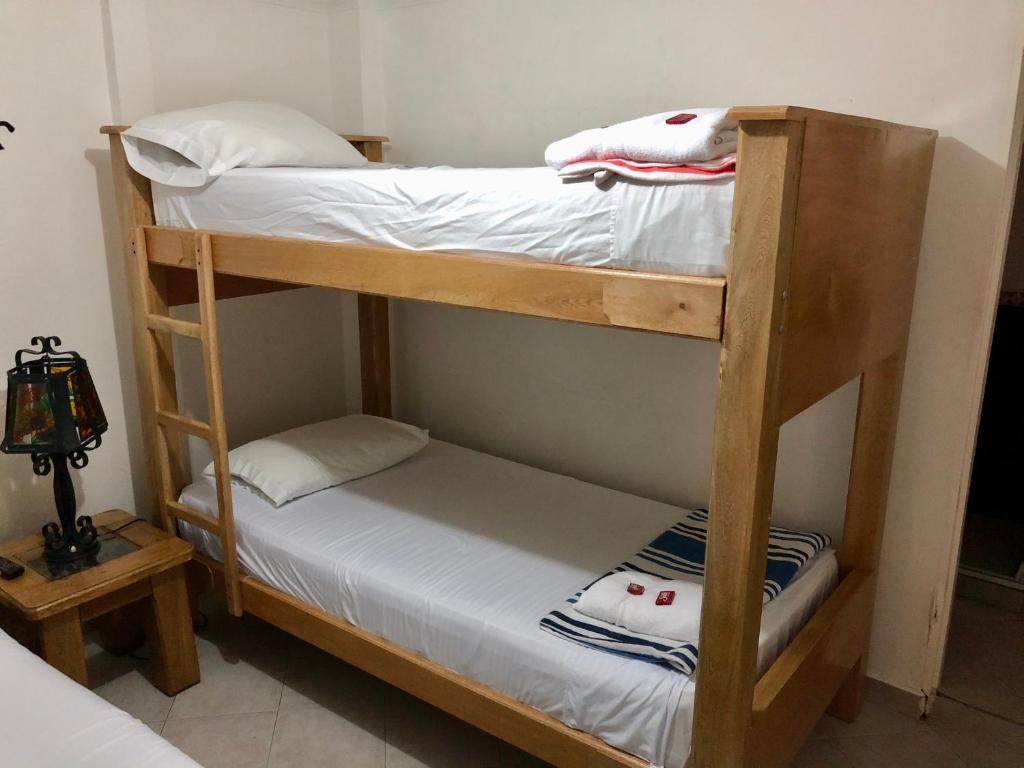 Postel nebo postele na pokoji v ubytování Hotel Casa Malibú
