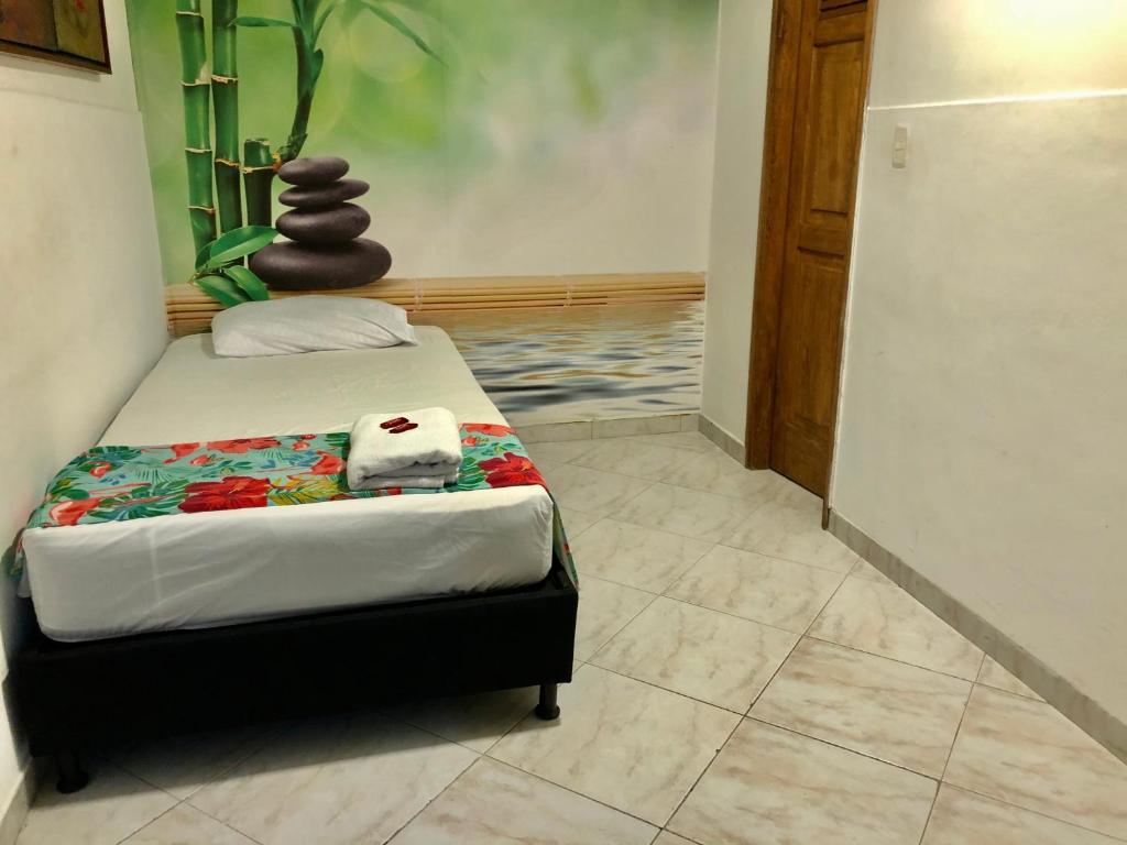 Postel nebo postele na pokoji v ubytování Hotel Casa Malibú