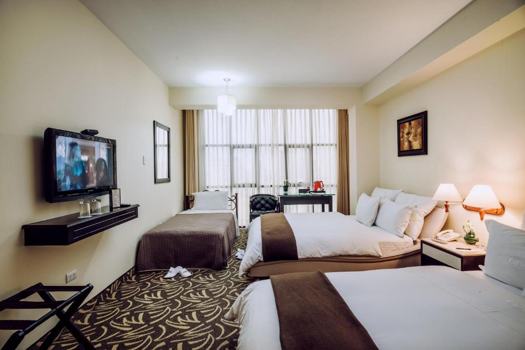 Postel nebo postele na pokoji v ubytování Hotel Nobility