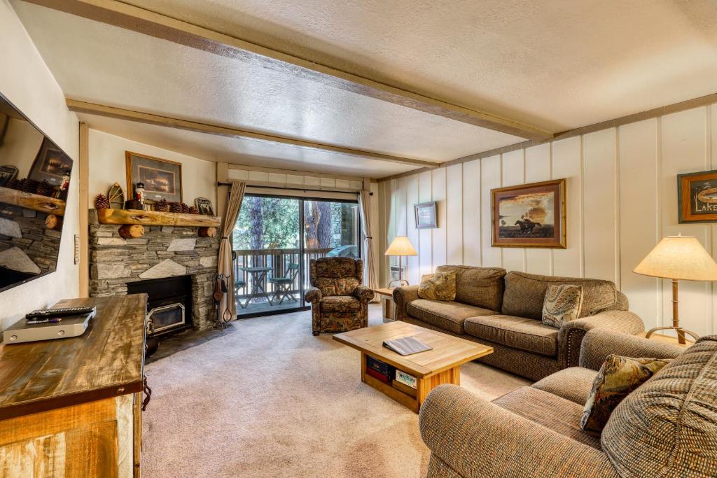 a living room with a couch and a fireplace at The Summit 5 in Mammoth Lakes