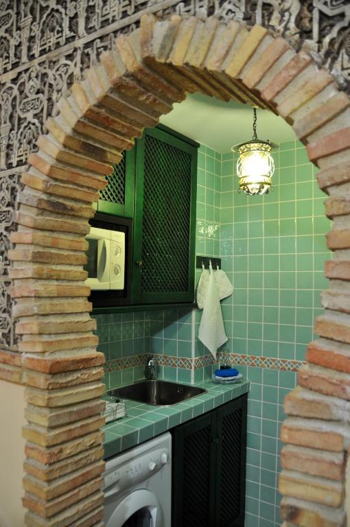 Kuchyňa alebo kuchynka v ubytovaní Apartamentos Boutique Doña Maria La Brava