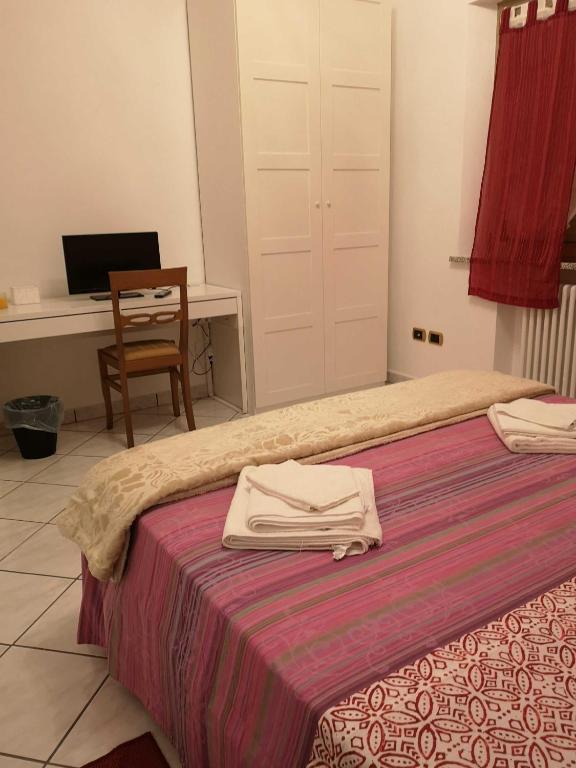 Łóżko lub łóżka w pokoju w obiekcie Sul Confine