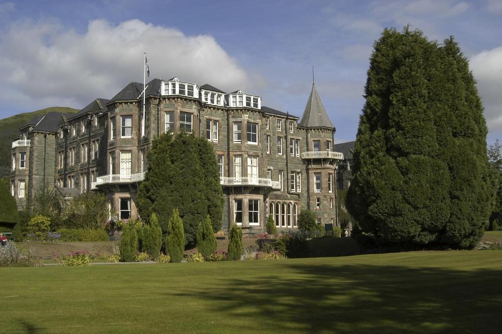 a large building with a large window in the middle of it at Keswick Country House Hotel in Keswick