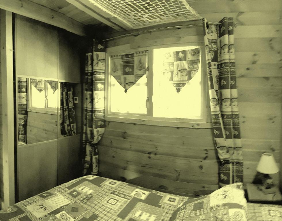 Postel nebo postele na pokoji v ubytování Chalet L' ADRET