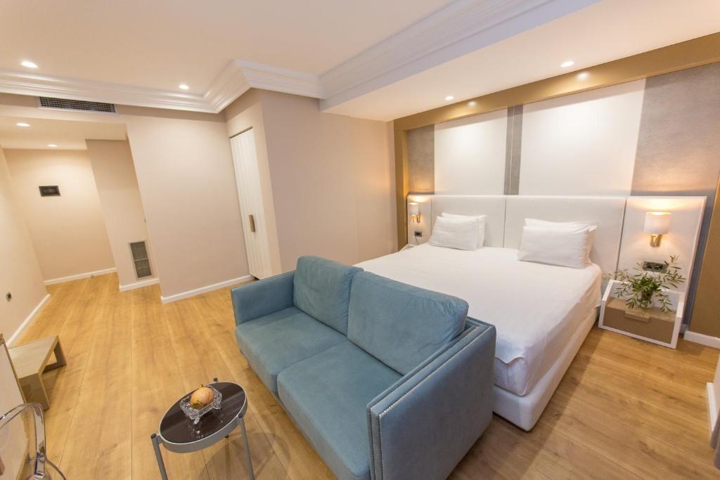 Postel nebo postele na pokoji v ubytování Hotel Brilant Saranda