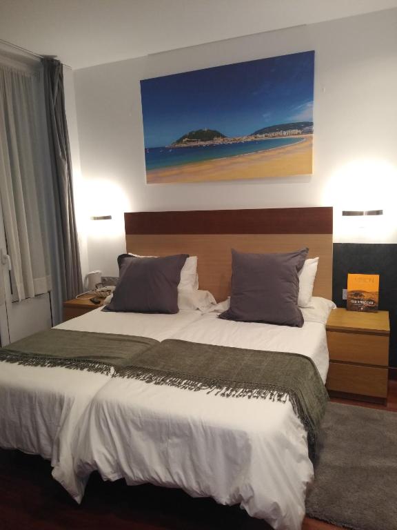 Posteľ alebo postele v izbe v ubytovaní Hostal San Sebastian Centro