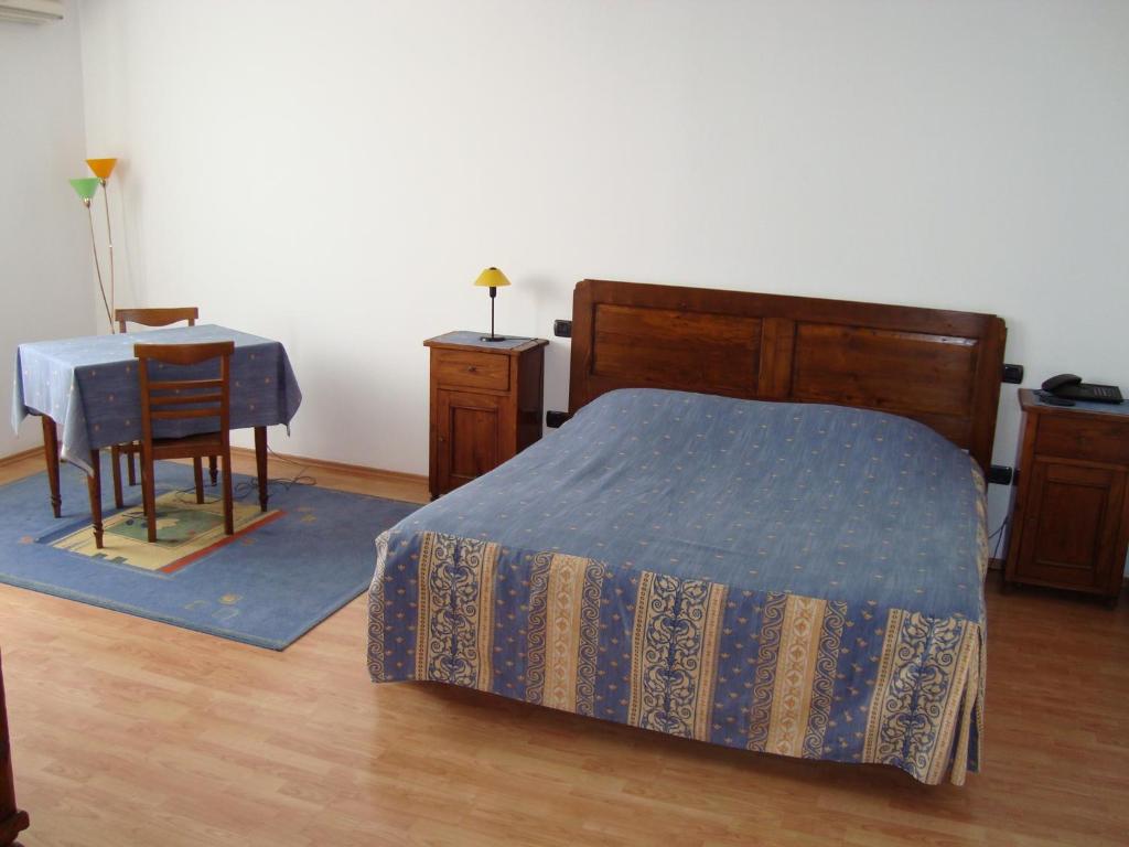 Säng eller sängar i ett rum på Vila Zoppas Inn