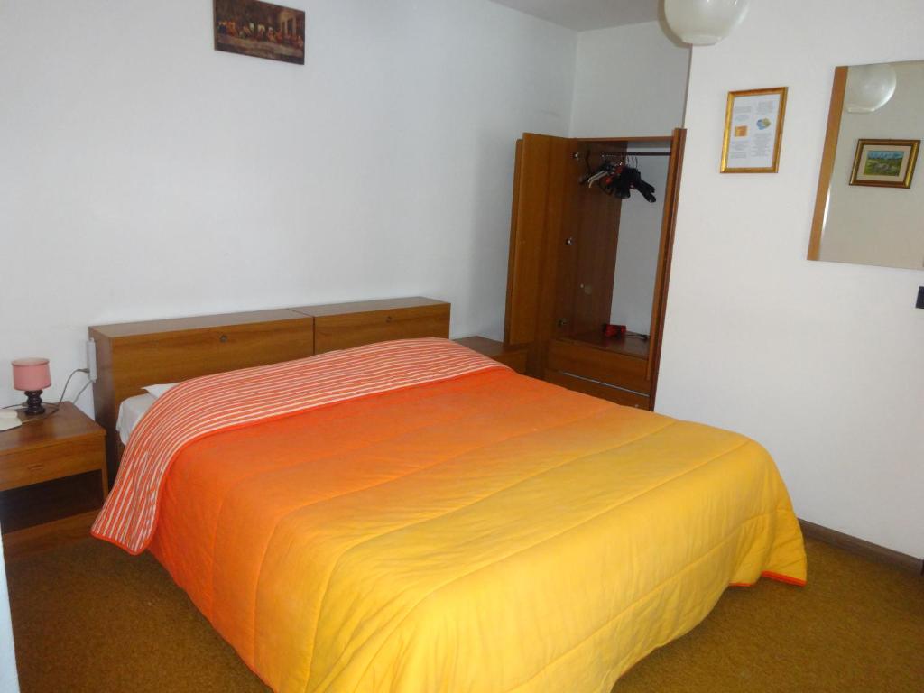 Postel nebo postele na pokoji v ubytování Hotel Genzianella