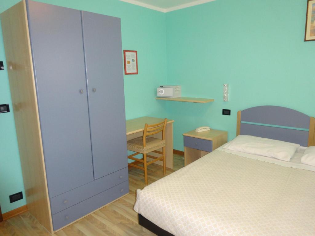 Postel nebo postele na pokoji v ubytování Hotel Genzianella