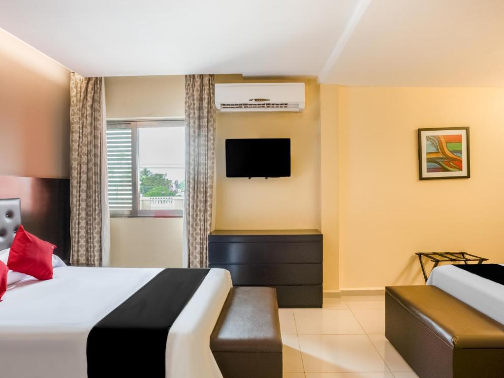 TV a/nebo společenská místnost v ubytování Veracruz Suites Hotel