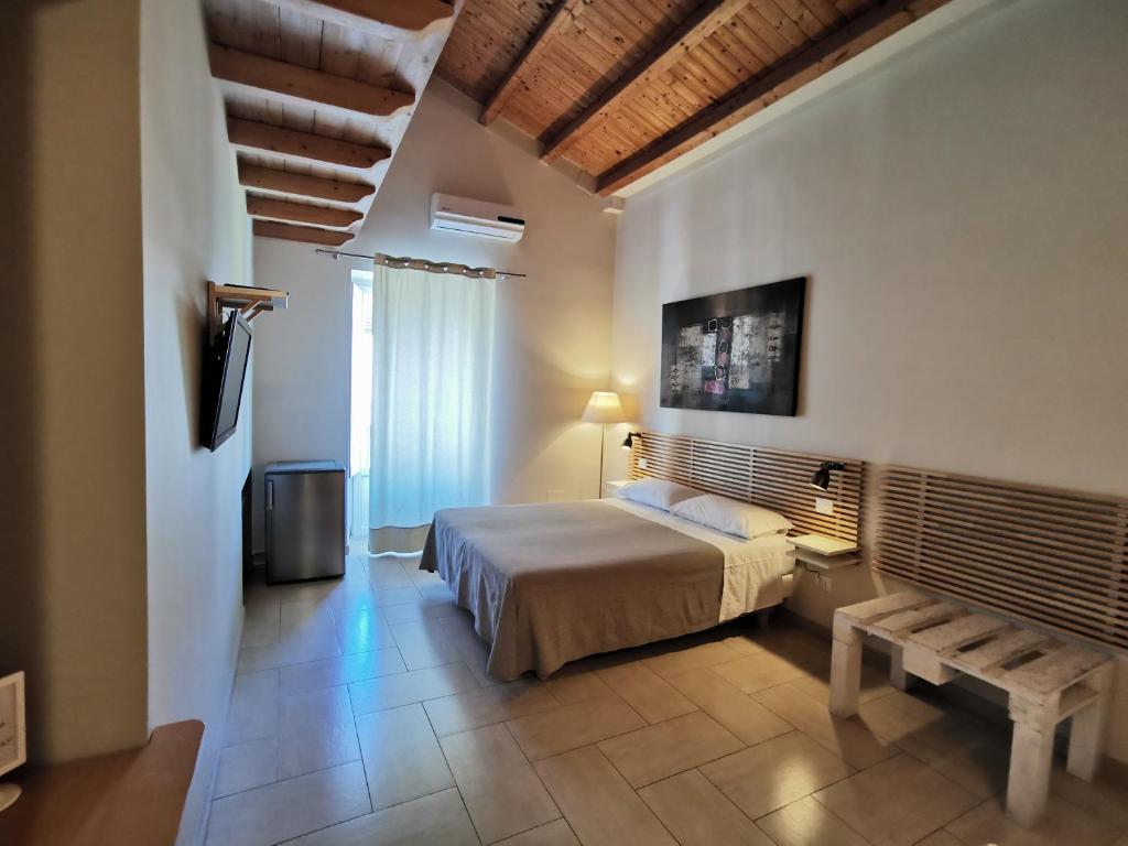 Postel nebo postele na pokoji v ubytování B&B Re Umberto
