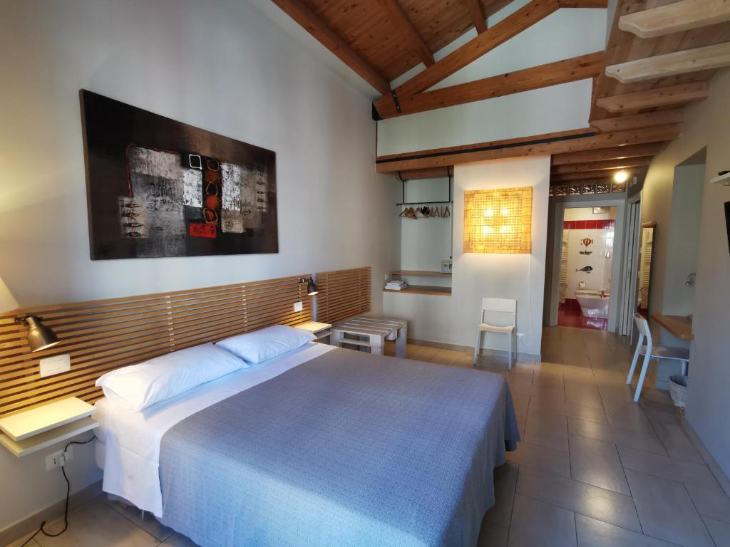 Postel nebo postele na pokoji v ubytování B&B Re Umberto