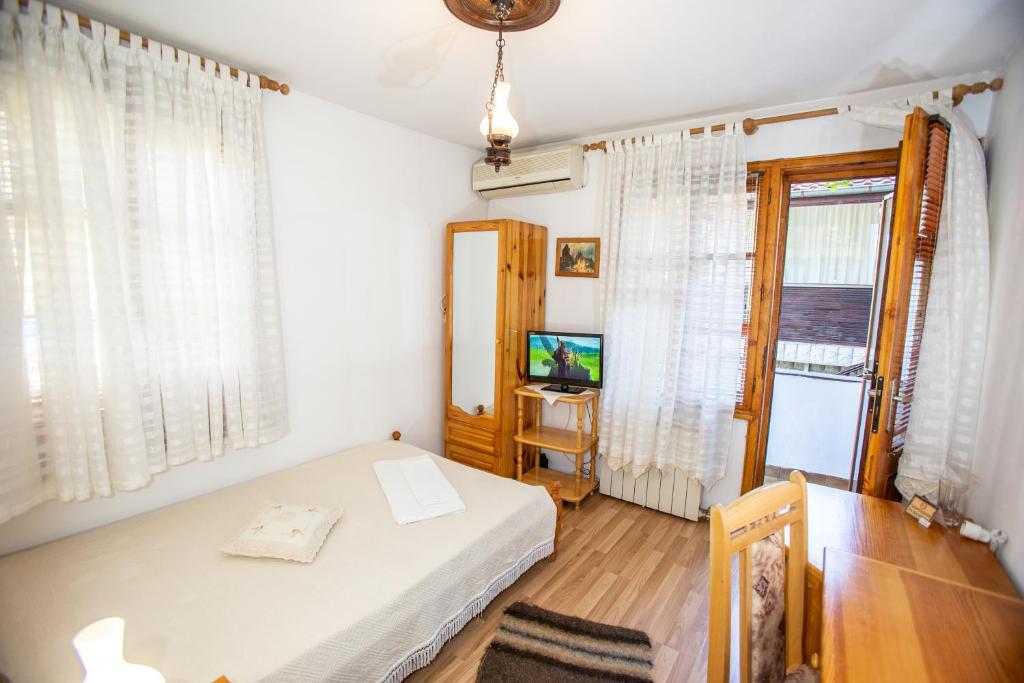 Postel nebo postele na pokoji v ubytování Oazis Family Hotel