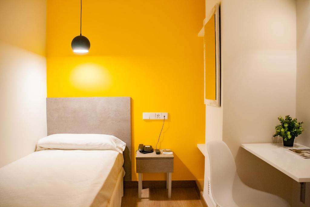 Postel nebo postele na pokoji v ubytování Hotel Universal Murcia