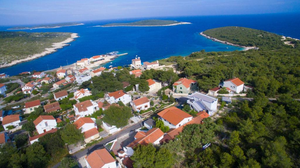 an aerial view of a small town next to the water at The Sea House Apartments in Vis