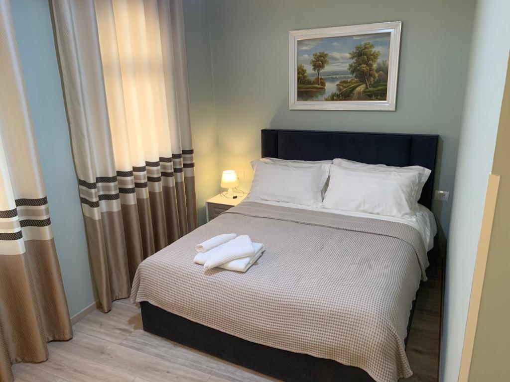 Postel nebo postele na pokoji v ubytování BELUX HOTEL