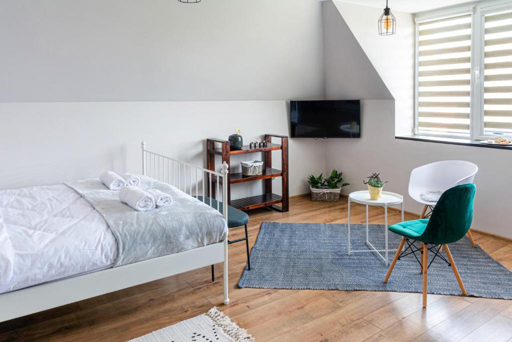 Postel nebo postele na pokoji v ubytování Gladstone suites