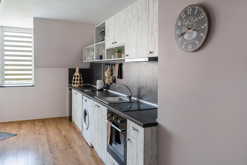 Kuchyň nebo kuchyňský kout v ubytování Gladstone suites