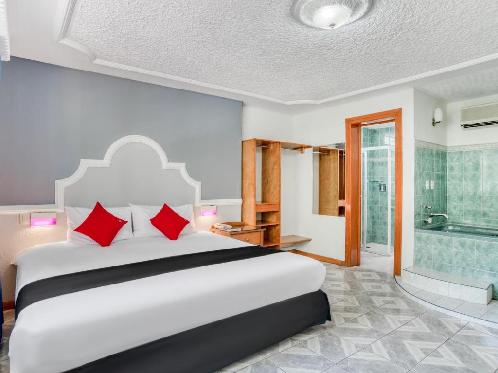 Postel nebo postele na pokoji v ubytování Hotel y Spa Posada Mirador