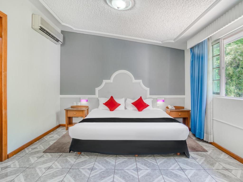 Postel nebo postele na pokoji v ubytování Hotel y Spa Posada Mirador