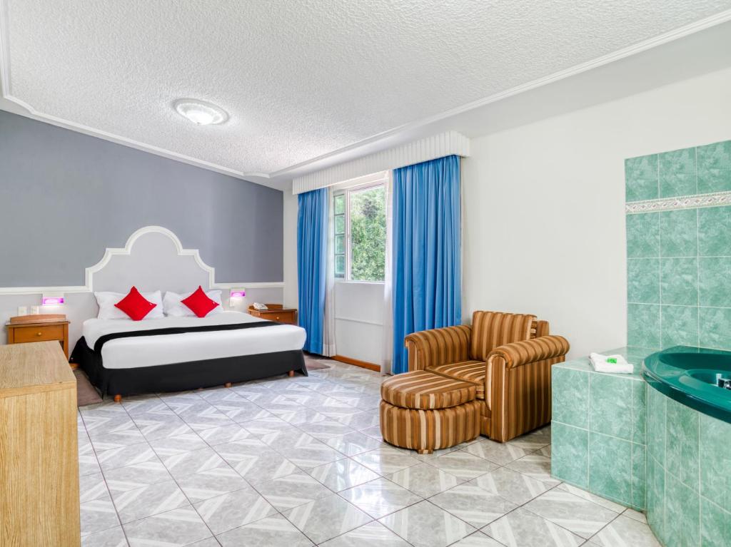Postel nebo postele na pokoji v ubytování Hotel y Spa Posada Mirador