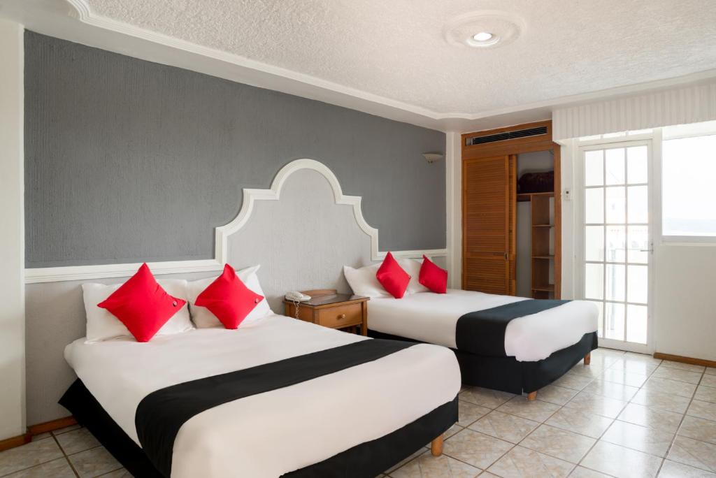 Postel nebo postele na pokoji v ubytování Hotel y Spa Posada Mirador