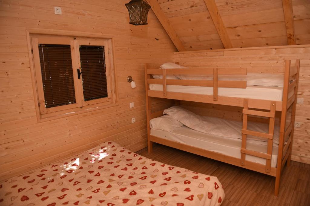Postel nebo postele na pokoji v ubytování Apartmani Kod Draskovica