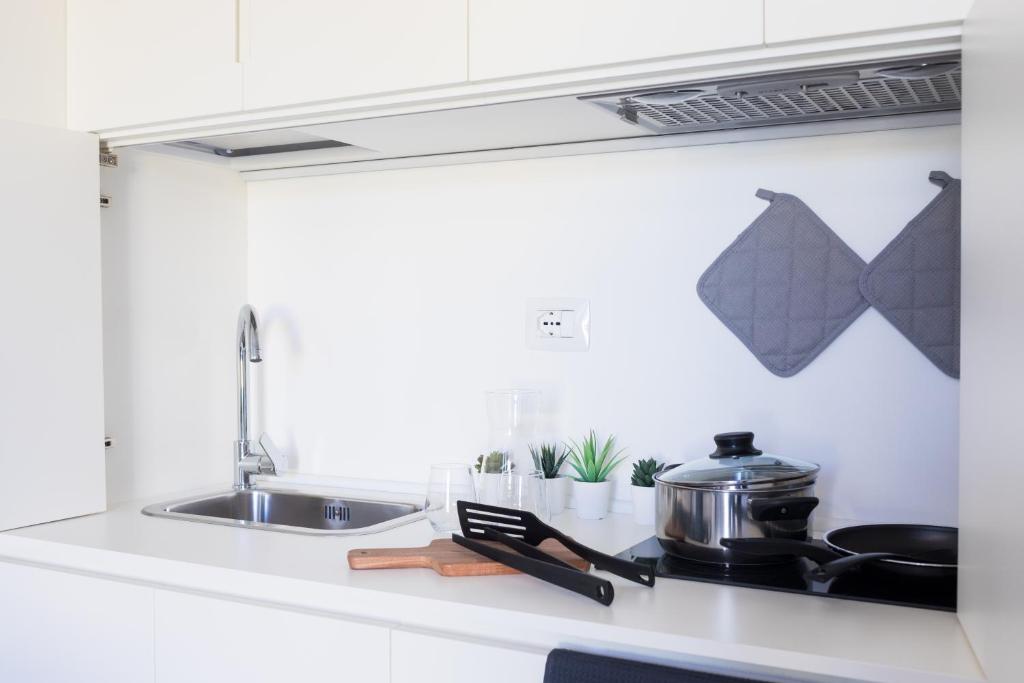A kitchen or kitchenette at ASPIO RESIDENCE
