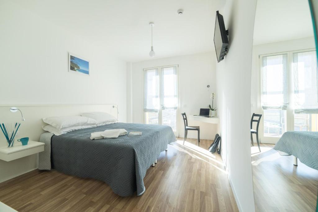 A bed or beds in a room at ASPIO RESIDENCE