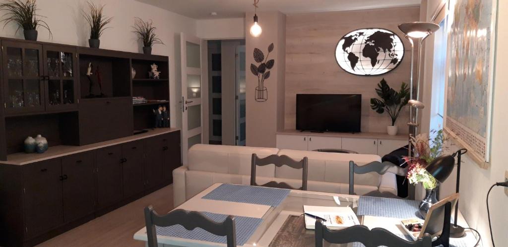 a living room with a couch and a table at Charta Appartement in Kortenberg