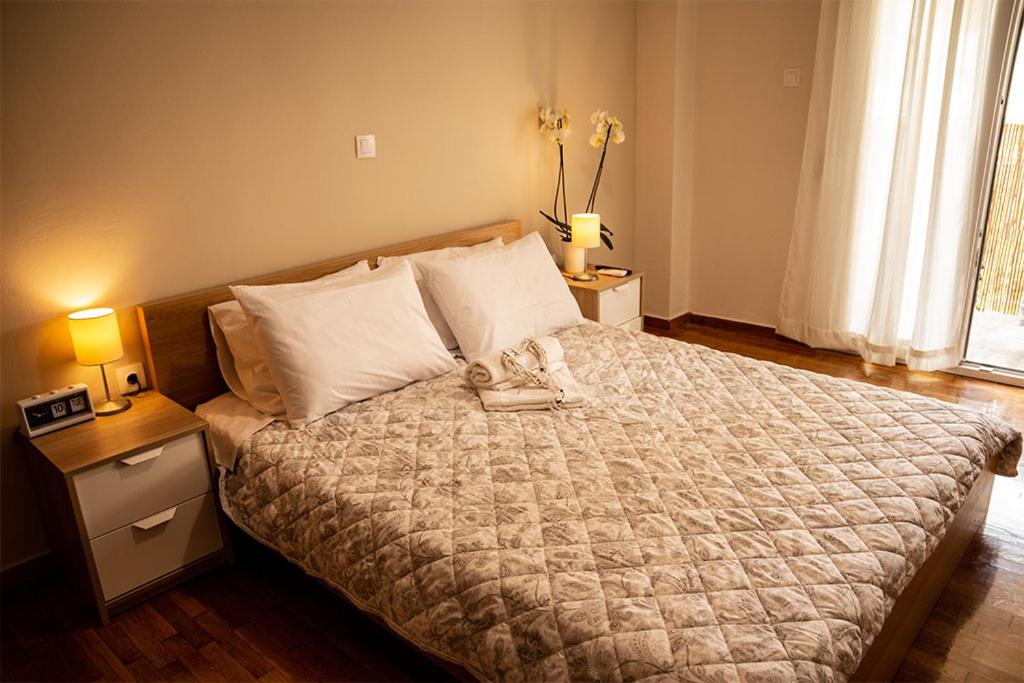 A bed or beds in a room at Your apartment in Athens (Next to Metro & Acropolis)