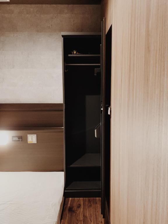 Postel nebo postele na pokoji v ubytování Hotel Capsule Inn Shizuoka