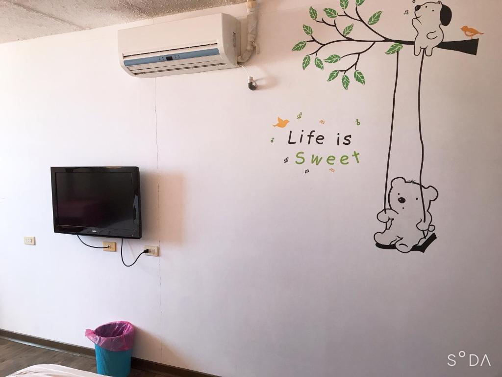 TV a/nebo společenská místnost v ubytování Sheng Feng Homestay