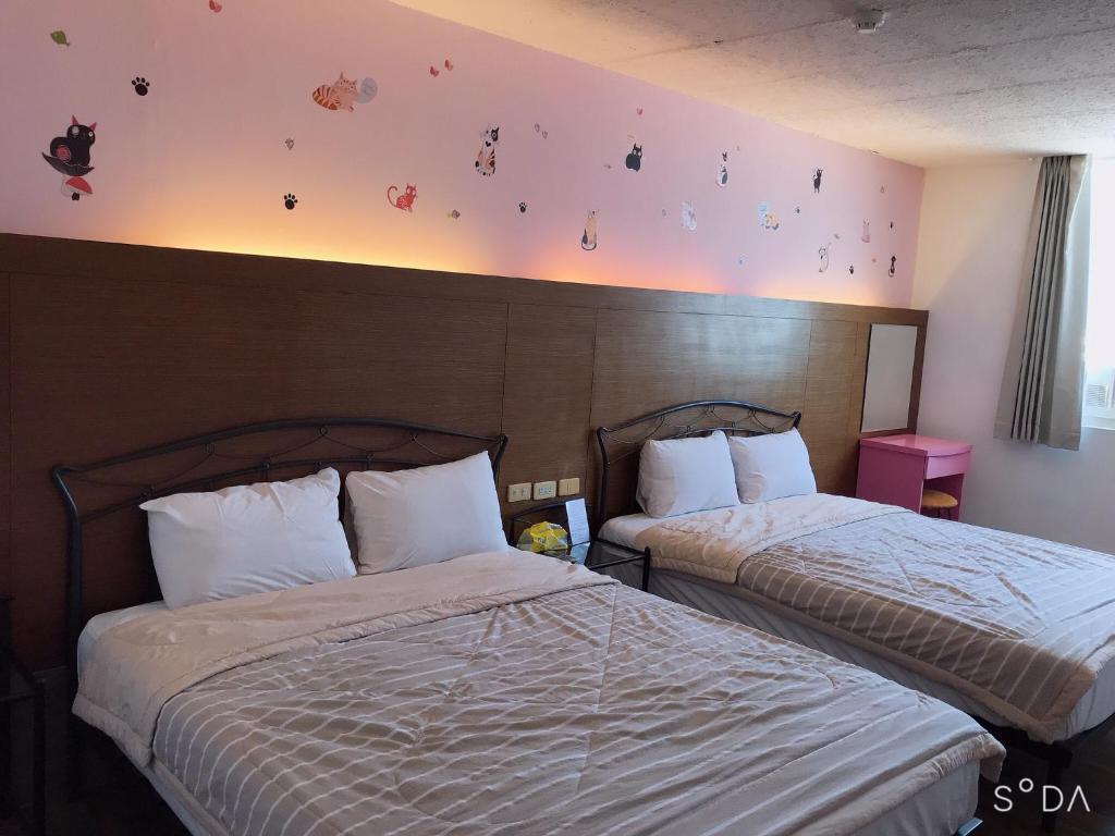 Postel nebo postele na pokoji v ubytování Sheng Feng Homestay