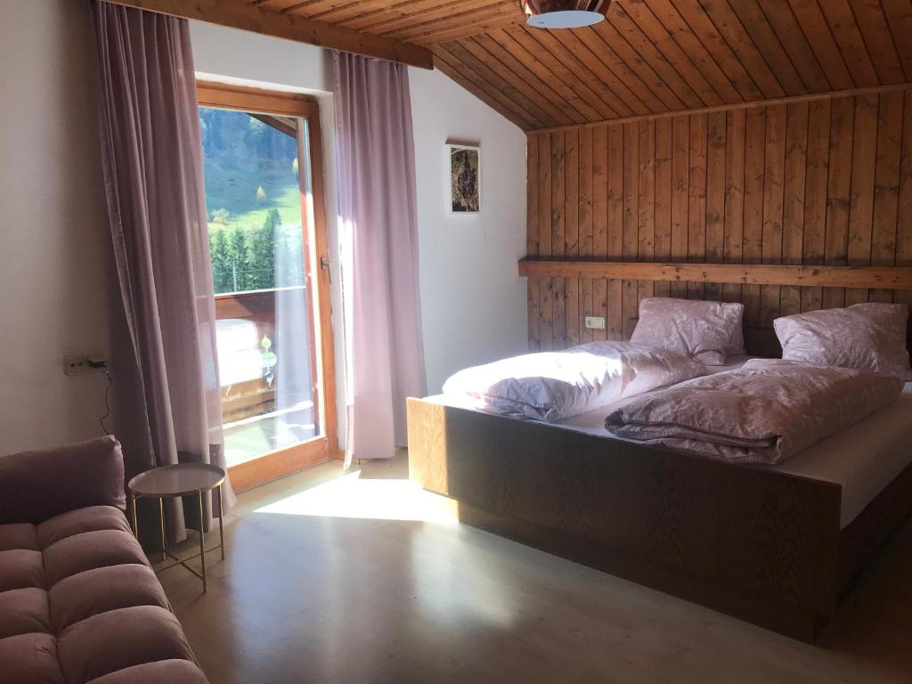 Postel nebo postele na pokoji v ubytování Reiterhof Nigglgut