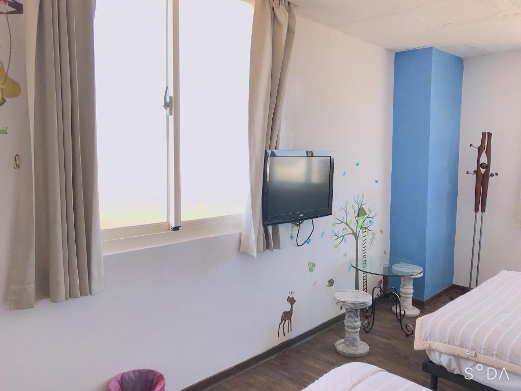 Postel nebo postele na pokoji v ubytování Sheng Feng Homestay