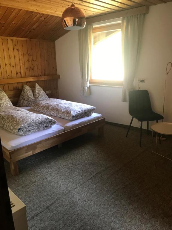 Postel nebo postele na pokoji v ubytování Reiterhof Nigglgut