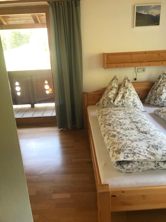 Postel nebo postele na pokoji v ubytování Reiterhof Nigglgut